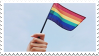 a stamp of a hand holding a pride flag